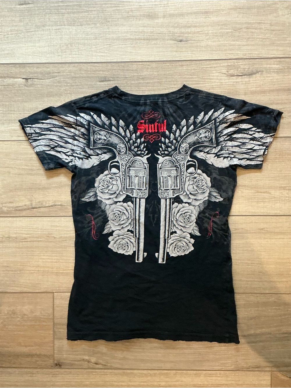 Sinful Black Tee with Winged Pistols and Rose Motif